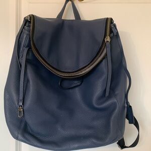 Geniune Tumi women’s blue pebbled leather with Tumi tracker